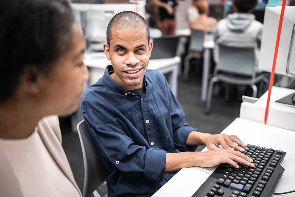Man with visual access needs using a computer